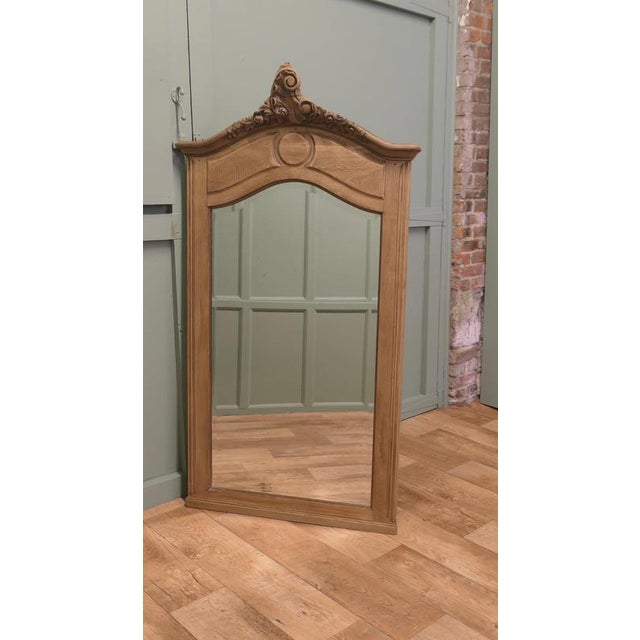 An ideal piece for the hall, a tall mirror, with decorative carved top in the French style, a Napoleon III classic This...