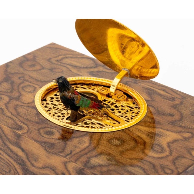Reuge Music No. 198 Ash Wood Singing Bird Box, the gilt metal oval top opening to pierced interior with automaton bird,...