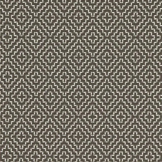 With its nuanced tonal variations and cross-stitch pattern, this graphic fabric has the appeal of a handcrafted textile....