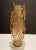 Freeform gilt iron tree branch, floral stem styling and gold fleck art glass vase. Tapered cylindrical gold fleck tinted...