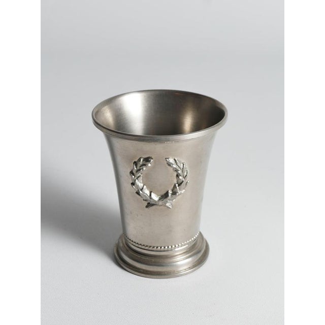 An exquisite mid-century pewter vessel by the prestigious swedish design house svenskt tenn, dated 1967. This beautifully...
