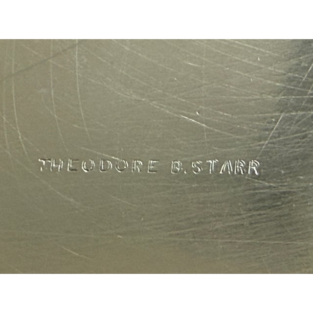 A beautifully crafted sterling silver serving bowl by the distinguished New York luxury retailer Theodore B. Starr,...