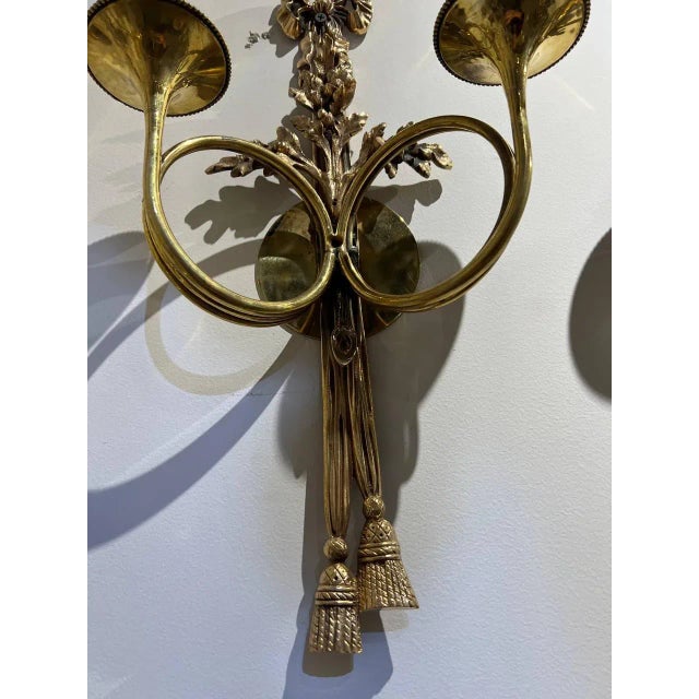 A pair of circa 1920’s French gilt bronze double lights sconces