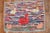 A handmade decorative American hooked rug from the middle of the 20th century with a few jolly ducks floating on a...