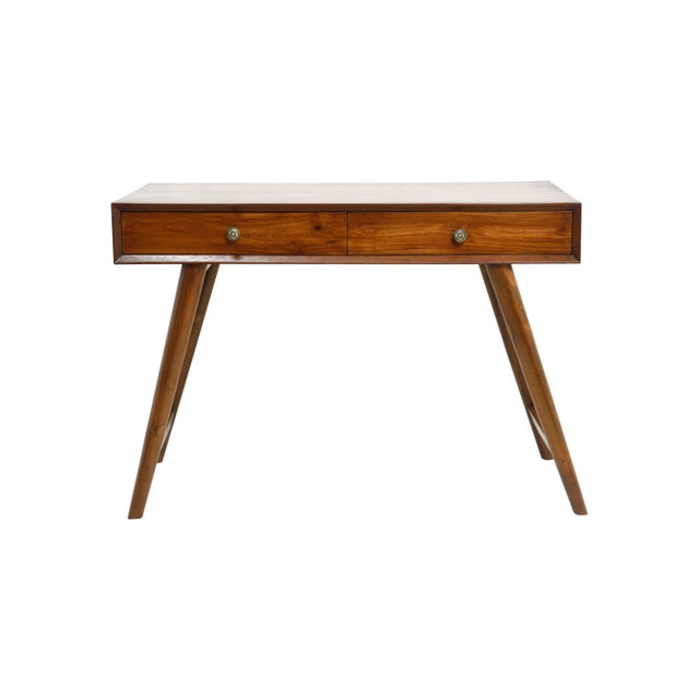 A simple and elegant Mid-Century Modern teak writing desk with splayed legs and featuring two front drawers with embossed...