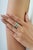 The Modern 3.82 Ct Blue Topaz & Green Onyx Spinner Eternity Band Ring features a striking combination of blue and green...