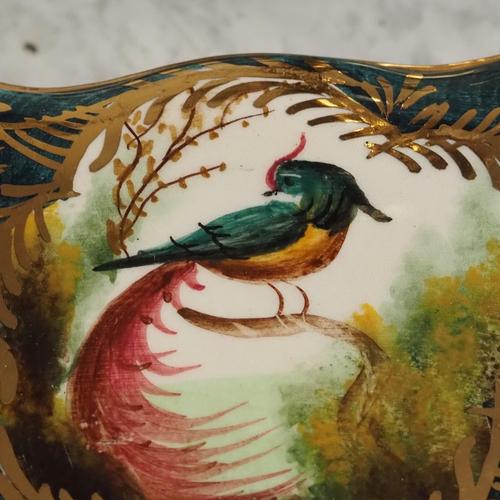 Decorative ceramic jar made in Belgium, featuring a hand-painted bird motif and gilding. Typical mid-century design with...