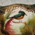 Decorative ceramic jar made in Belgium, featuring a hand-painted bird motif and gilding. Typical mid-century design with...