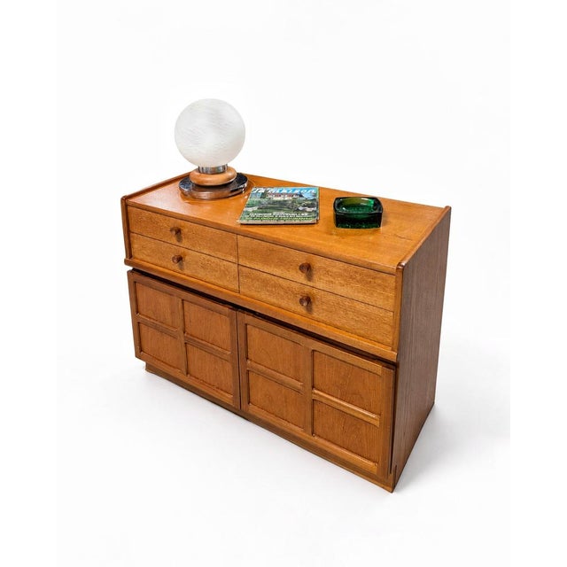 Teak sideboard manufactured in the 1960s by the English firm Nathan, from the "Squares" series. The top has some...