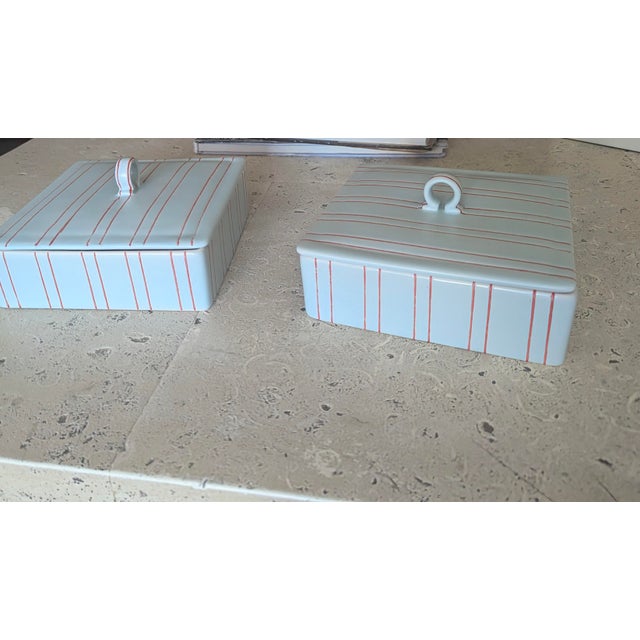 Pair of gorgeous mint condition smooth to the touch ceramic. Beautiful light blue ith red accents, striped exterior and...