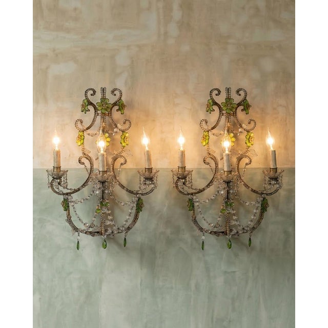 Pair of early 20th century italian crystal beaded sconces or applique fixtures with green crystal glass flowers. these...
