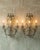 Pair of early 20th century italian crystal beaded sconces or applique fixtures with green crystal glass flowers. these...