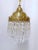 This is a decorative Italian layered chandelier with brass dome and 30% spear faceted crystal drops. It has 1 Edison base...