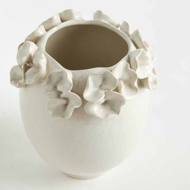 The multifloral design of this vase is truly extraordinary. The sculpted buds are handapplied and each piece is uniquely...