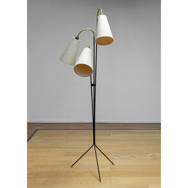 A striking floor lamp designed by Svend Aage Holm Sørensen, Sweden, in the 1950s. This elegant piece features three...
