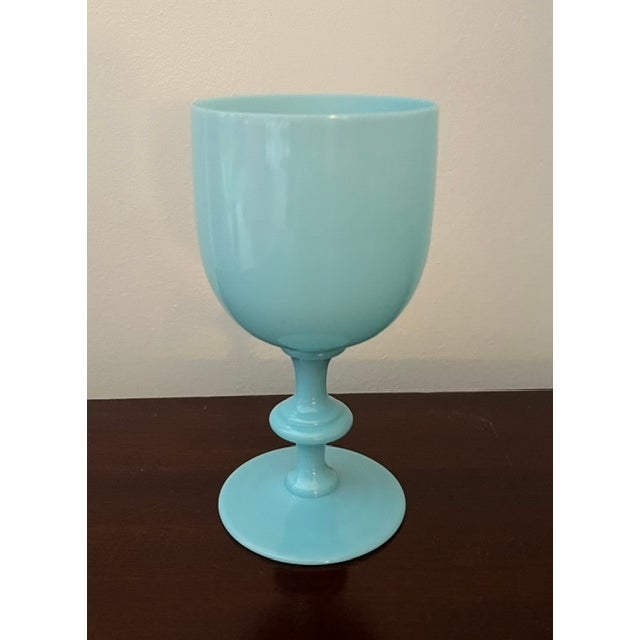 Set of three assorted 1930s blue opaline blown glass goblets of various heights. All three goblets are a beautiful robin's...