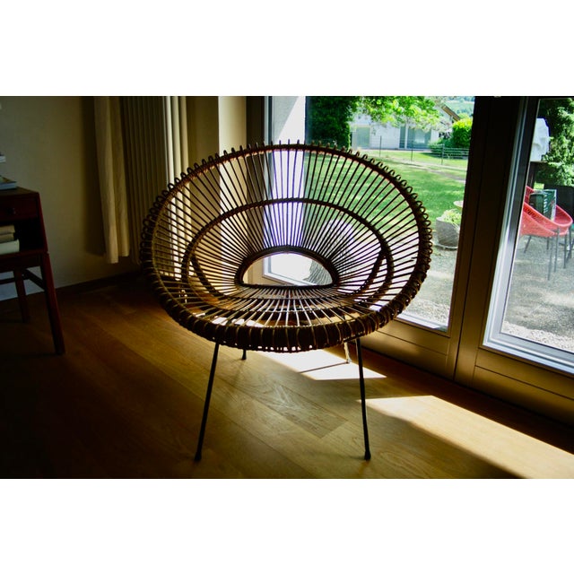 Composed of a natural rattan structure suitable for indoor use as well as on a covered terrace, with black metal legs in...