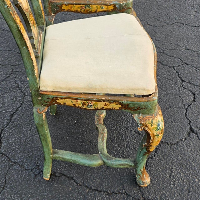 Pair of Italian Venetian Rococo Polychrome and Parcel-Gilt Hand-Painted Side Chairs, Early 20th Century An exceptional...
