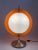 Ball lamp *Large, satin glass ball (36 cm) with a spherical umbrella made of orange plastic that can be rotated around the...