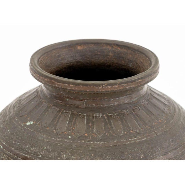 Indian Brass and Copper Lota Water Pot, with engraved scrolling floral decoration. 6" H x 5.5" Diameter. Provenance: From...
