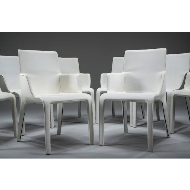 Elegant set of 8 gio dining chairs by walter knoll, upholstered in ecru leather. Professionally restored in our workshop,...