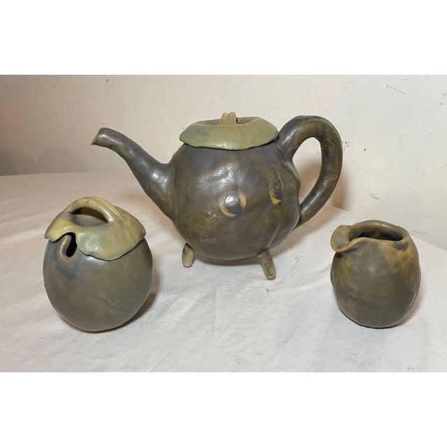 This antique Japanese teapot set is a beautiful addition to any collection. This set is handmade with green glazed...