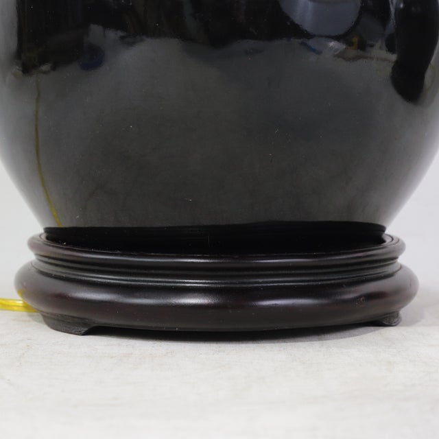 A Pair Early 20th Century Black Monochrome Porcelain Watermelon Jar Table Lamps on Carved Wood Bases For Sale - Image 10 of 15