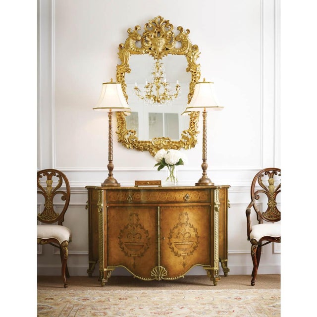 This exquisite English mirror, inspired by the craftsmanship of Grinling Gibbons, features a stunning undulating surround...