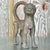 This charming vintage boho sculpture features a cat crafted from hammered metal. Its intricate detailing and rustic appeal...