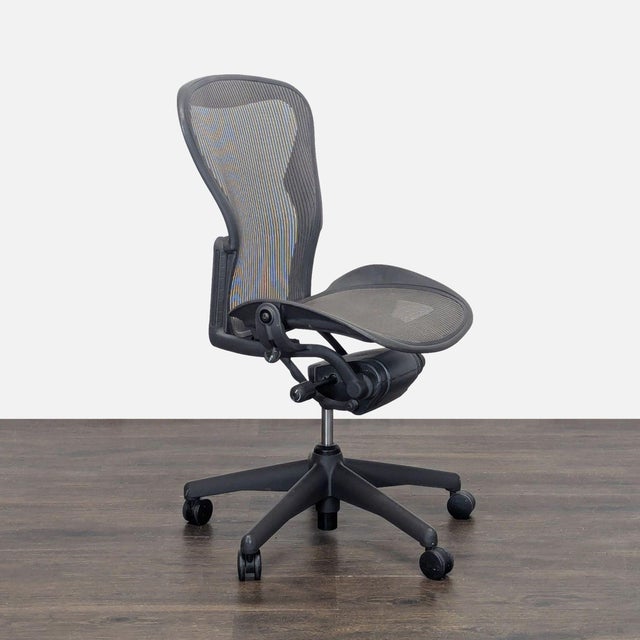 This authentic Herman Miller Aeron office chair features a breathable mesh seat and back for comfort and support. The...
