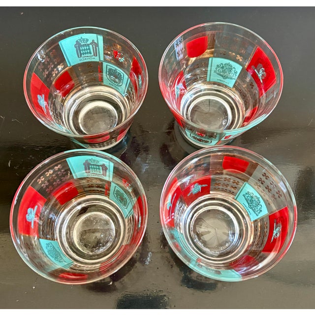 Rare Find - A set of four vintage Fred Press lowball glasses featuring colorful heraldic crests and European coat-of-arms...