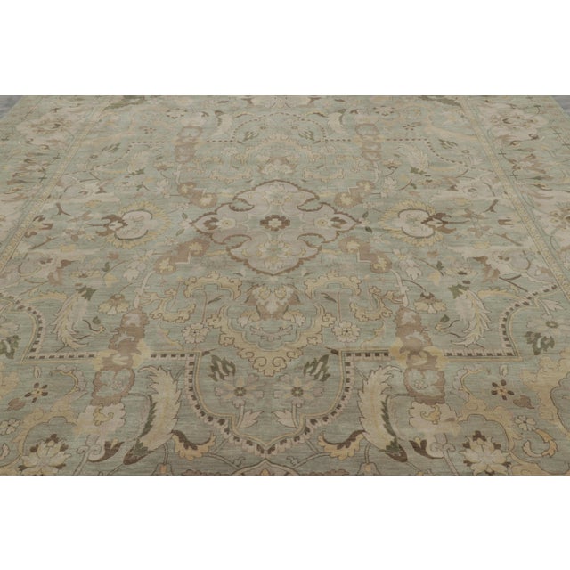 Hand-knotted in wool, this 10x14 modern Polonaise rug originating from Nepal is inspired by a particularly celebrated...