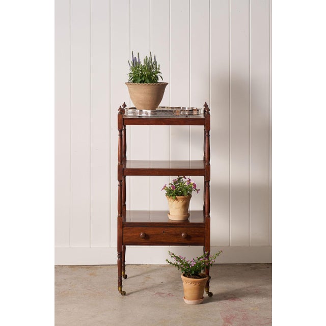 19th-century English rosewood whatnot featuring four graduated tiers and turned supports.