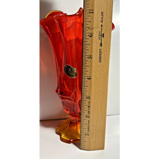 Beautiful vintage Fenton Art Glass Company handkerchief vase in stunning Amberina red. This elegant piece features the...