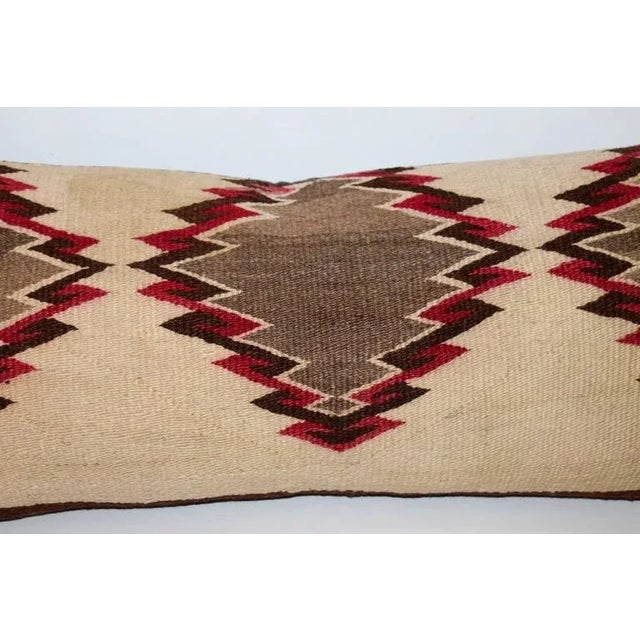 This geometric early weaving is in fine condition with most unusual colors of mauve and tan. The backing is in a brown...