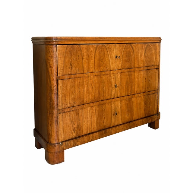 Vintage Biedermeier chest featuring a walnut veneer finish and classic casework design. Dimensions: 44" W x 22.3" D x 32"...
