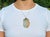 A marvelous item featuring a massive piece of carved variegated white and orange jade depicting the goddess Guanyin. For a...