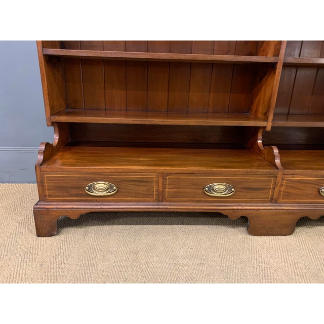 A very good Edwardian period mahogany open bookcase by Goodall, Lamb and Heighway of Manchester. with 6 shelves affording...
