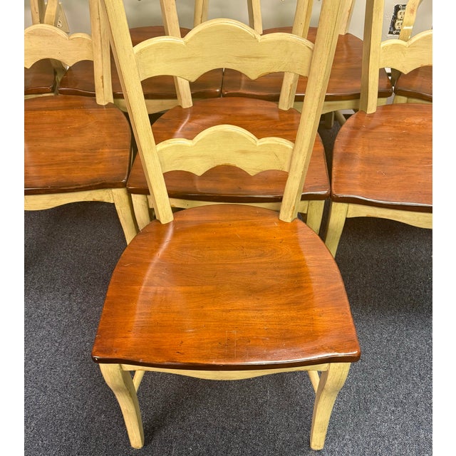 Set of Four Hooker Furniture French Country ladder back armchairs from their vineyard collection. High style shape...