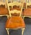 Set of Four Hooker Furniture French Country ladder back armchairs from their vineyard collection. High style shape...