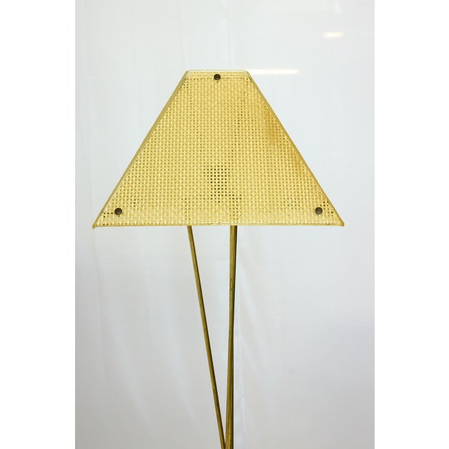Midcentury Italian tripod floor lamp of iron and brass with the original four panel translucent resin lampshade with a...