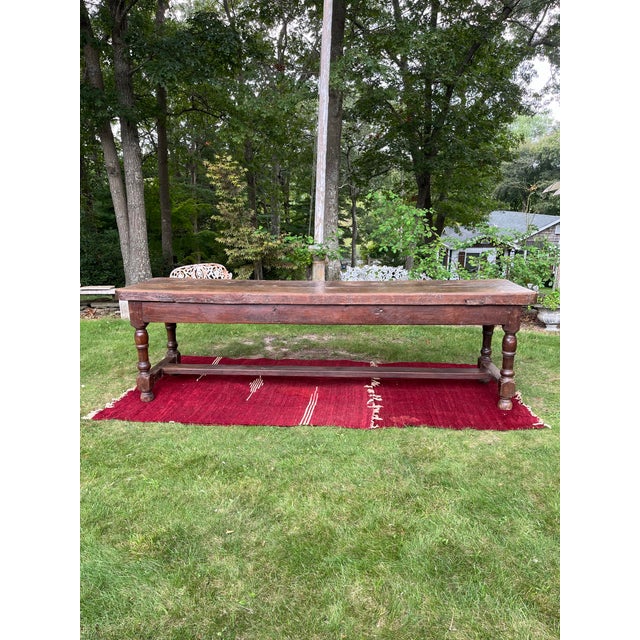 Stunning 18th century French Harvest Table with an incredible 3 1/2 inch thick, two board, removable walnut top. Fitting...