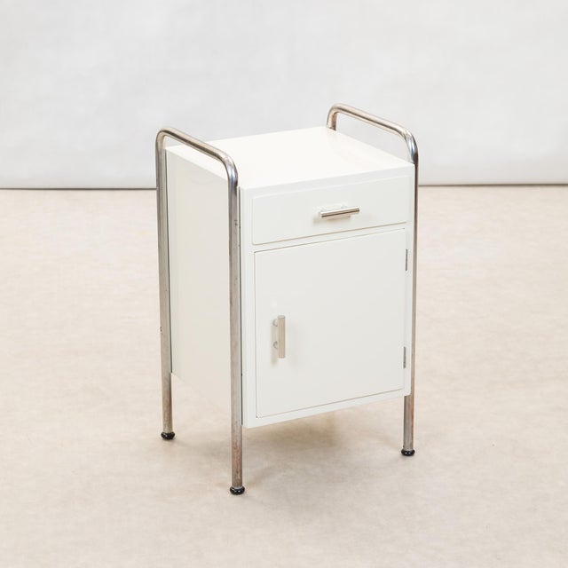 Functionalist Bedside Table attributed to Vichr & Co., 1930s, in Restored conditions. Designed 1920 to 1949 This piece is...