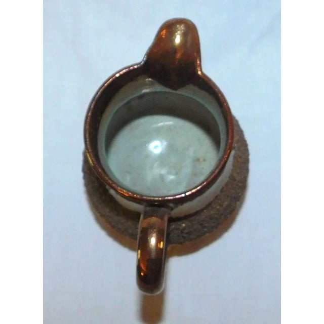 Lovely 19th century English copper lustre creamer with gravel band