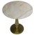 Two elemental materials meet in this quietly dramatic accent table. The base is formed of cast iron with a soft gold...