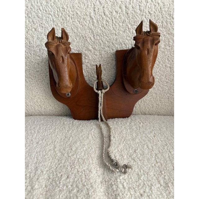 Solid wood hand carved wooden horse head equestrian wall hanger. Features two larger horse heads with intricate carved...
