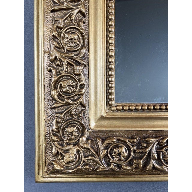 We present an elegant gilt carved wood mirror in the Louis-Philippe style, ideal for adding a touch of sophistication to...