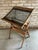 Vintage wooden adjustable writing table, featuring a tilting smoked glass top and a folding oak frame. This piece is fully...