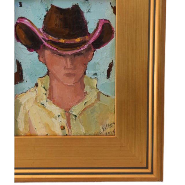 Impressionist oil painting on an artist's hardboard panel of a western cowboy with a hat displayed in a complementary...