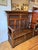 This stunning oak bench has dramatic carving with panels featuring gothic motifs and other panels displaying a stylized...